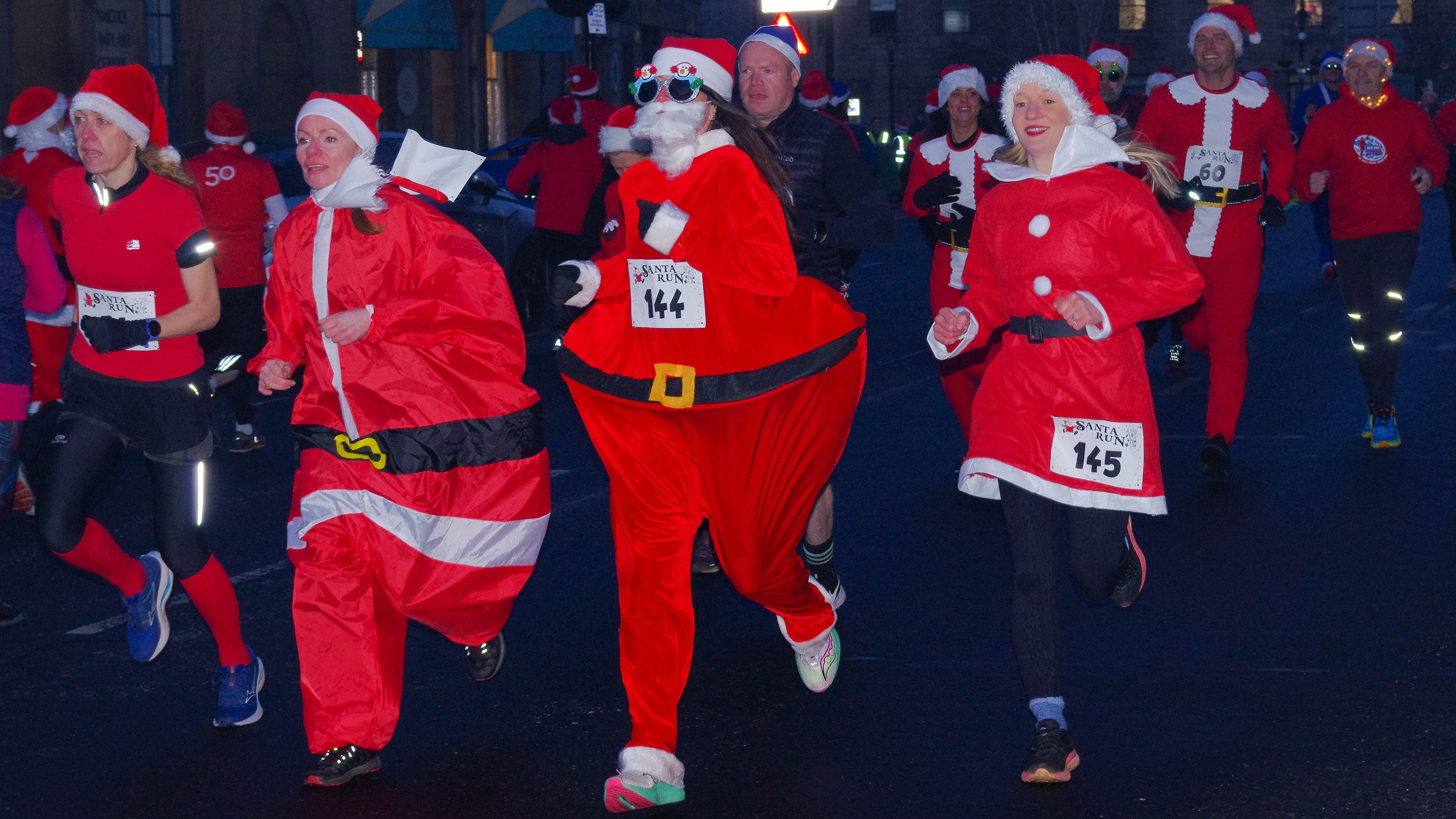 Santa dash runners in festive attire