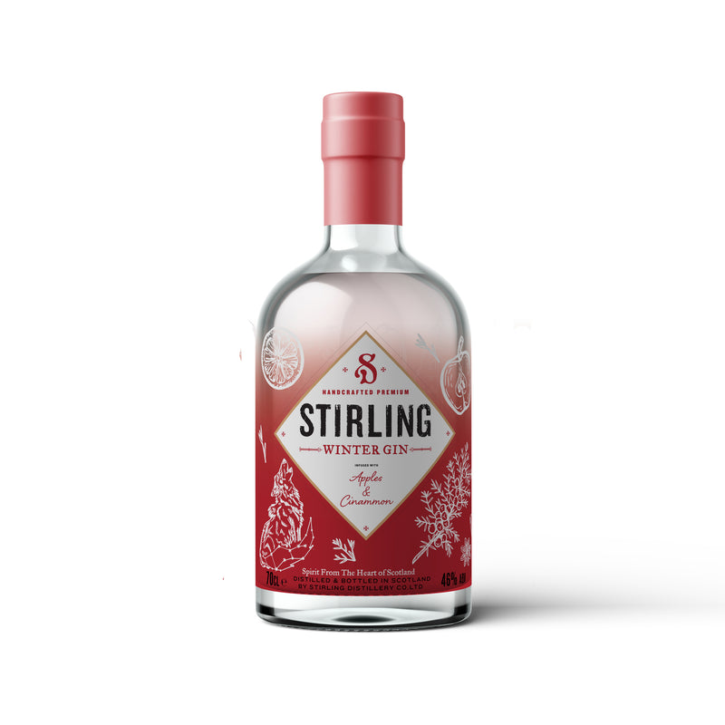 A bottle of Stirling Winter Gin with a red label, featuring illustrations that suggest a festive, wintery theme.